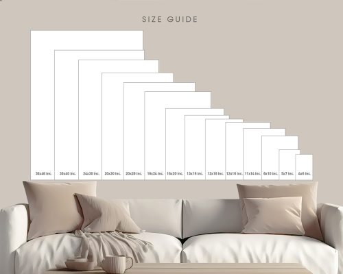 Size guide displaying various frame dimensions on a wall above a couch with cushions.