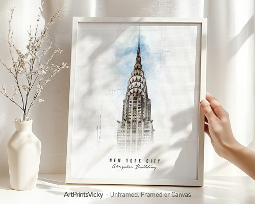 Art print of the Chrysler Building in New York City displayed in a frame held by a hand.