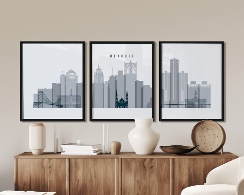 Three framed art prints of Detroit's skyline with notable buildings and structures.