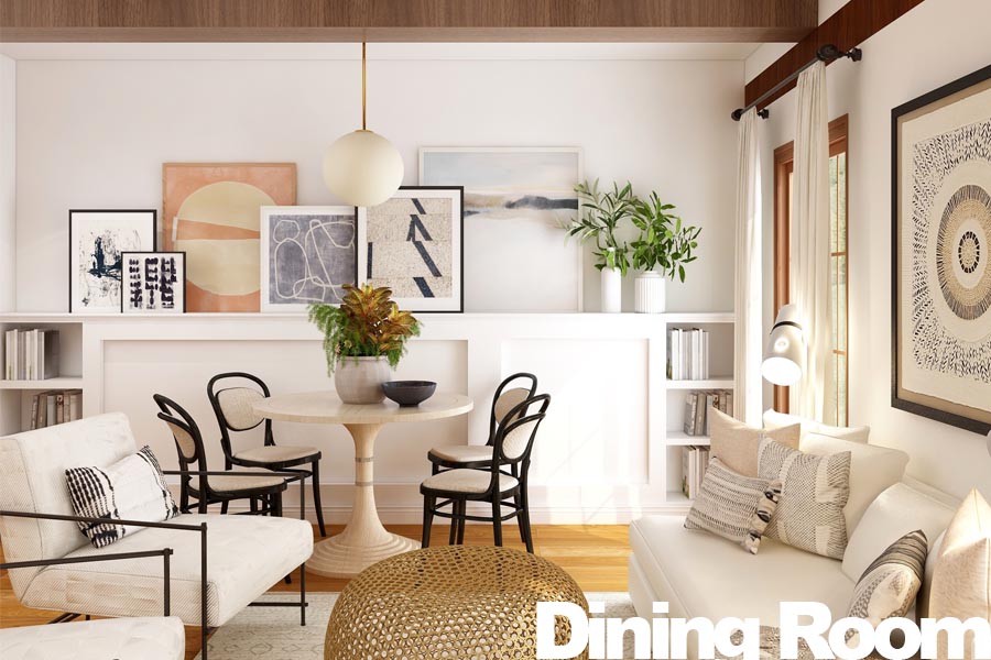 A dining room featuring a round table, chairs, and various artworks on the walls.