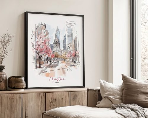 A black framed art print of Austin in watercolor drawing with soft pastel tones.