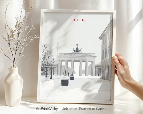Minimalist art print of the Brandenburg Gate in Berlin with a hand holding the frame.