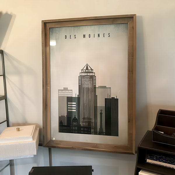 Framed print of a cityscape featuring buildings in Des Moines with a minimalist design.