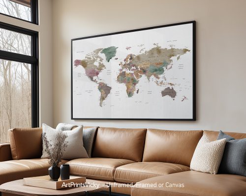 Framed world map artwork displayed on a wall above a brown leather sofa.