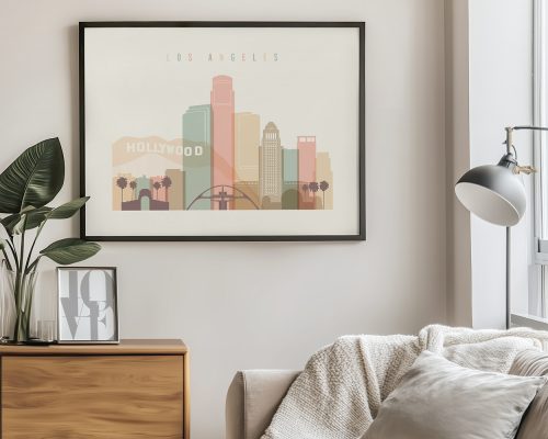 Framed artwork depicting a stylized cityscape of Los Angeles with a Hollywood sign.