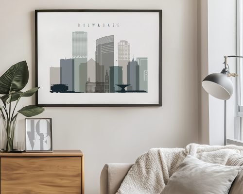 Framed artwork depicting the skyline of Milwaukee with various buildings and structures.