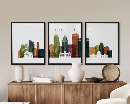 Three framed art prints depicting the skyline of Minneapolis in various colors.