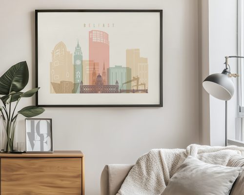 Illustration of Belfast's skyline featuring notable buildings in soft colors.