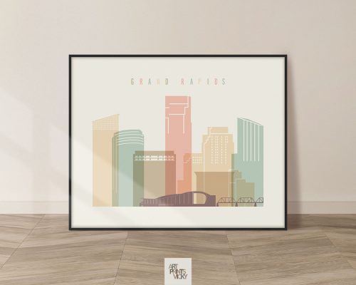 Framed artwork depicting a stylized cityscape of Grand Rapids with pastel colors.