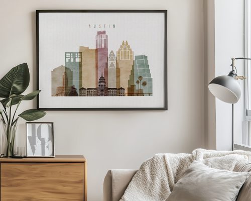 Framed artwork depicting a stylized cityscape of Austin with notable buildings and a muted color palette.