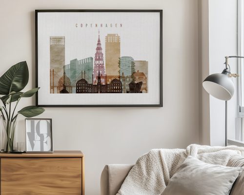 Framed artwork depicting a cityscape of Copenhagen with various buildings and a tower.