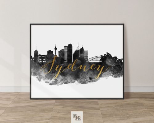 Art print featuring a silhouette of the Sydney skyline with the word 'Sydney' in gold lettering.