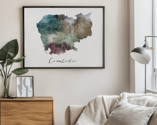 Watercolor map of Cambodia framed and displayed on a wall with a plant nearby.