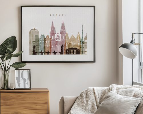 Framed artwork depicting a stylized cityscape of Prague with various buildings and towers.
