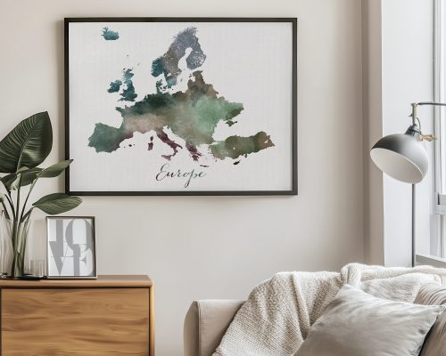 Watercolor-style map of Europe framed and displayed on a wall with a plant nearby.
