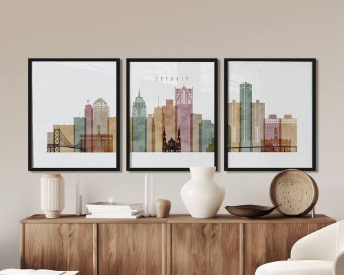 Three framed art prints depicting a stylized cityscape of Detroit with various buildings.