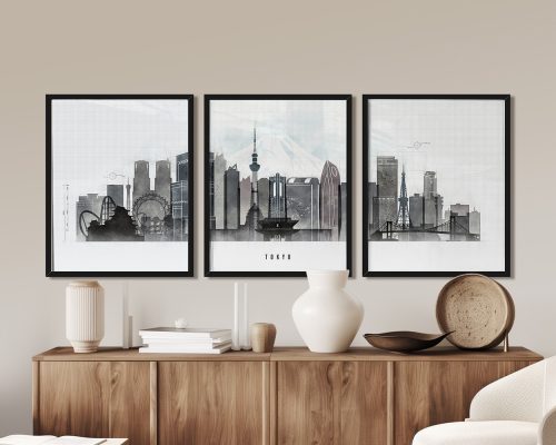 Three framed art prints of Tokyo's skyline featuring iconic landmarks and a mountain in the background.