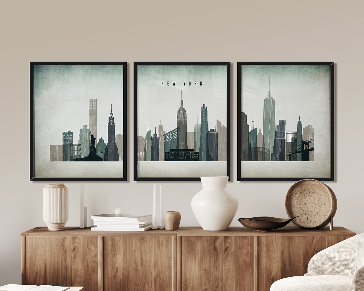 Three framed art prints depicting the New York City skyline in a minimalist style.