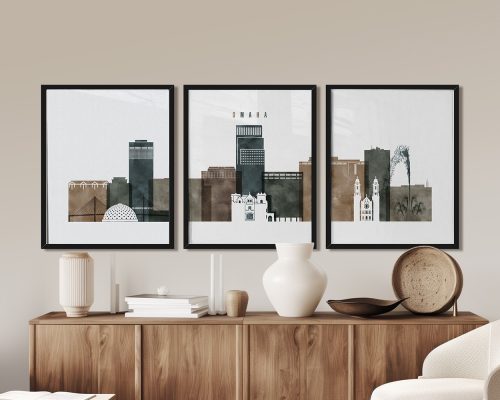 Three framed art prints depicting a stylized skyline of Omaha in neutral tones.