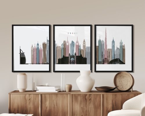Three framed art prints depicting a stylized cityscape of Dubai with various buildings and structures.