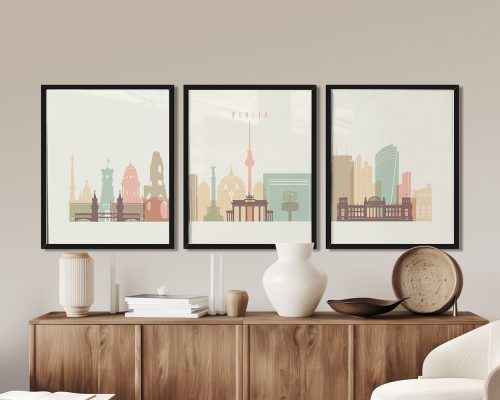 Three framed art prints depicting a stylized cityscape of Berlin with notable landmarks.