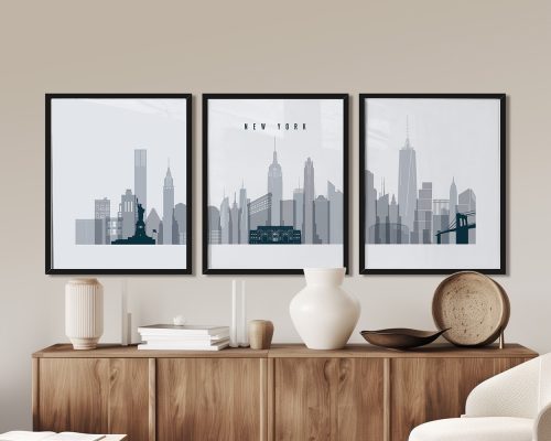 Three framed art prints of the New York City skyline in a minimalist design with gray tones.
