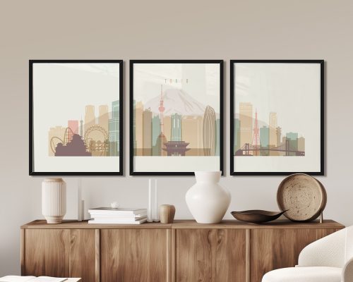 Three framed art prints of Tokyo's skyline featuring iconic landmarks and structures.