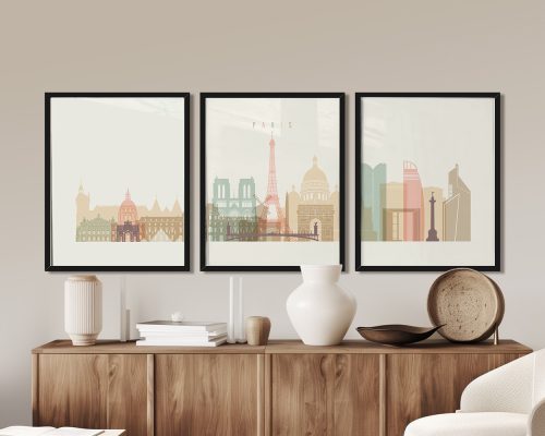 Three framed art prints depicting iconic Paris landmarks including the Eiffel Tower and Notre-Dame Cathedral.
