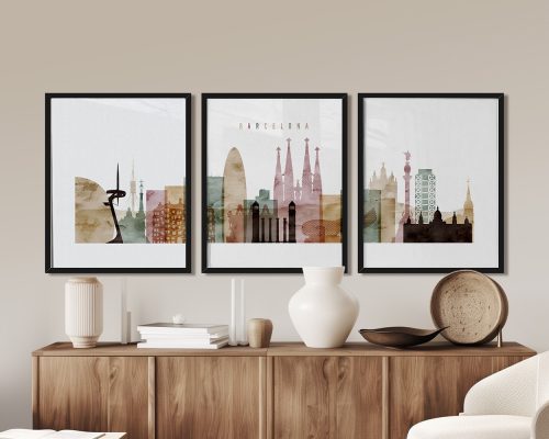 Three framed art prints depicting the skyline of Barcelona with various landmarks and colors.