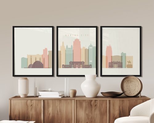 Three framed art prints depicting the skyline of Kansas City in pastel colors.