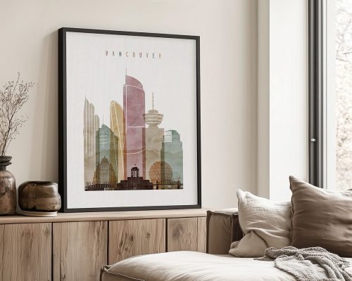 Framed artwork depicting a stylized cityscape of Vancouver with various buildings and structures.