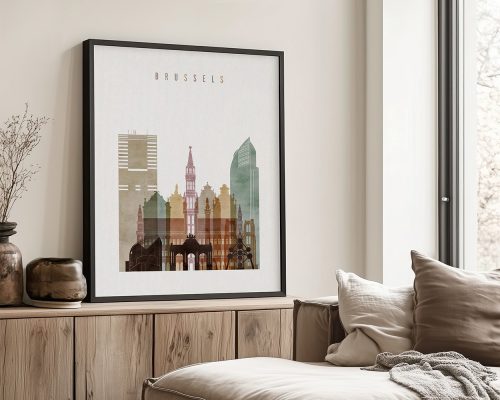 Framed artwork depicting a cityscape of Brussels with various buildings and structures.