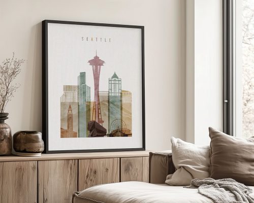 Framed artwork depicting a stylized cityscape of Seattle with the Space Needle and other buildings.
