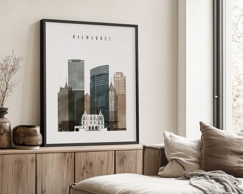 Framed artwork depicting a cityscape of Milwaukee with buildings and a historical structure.
