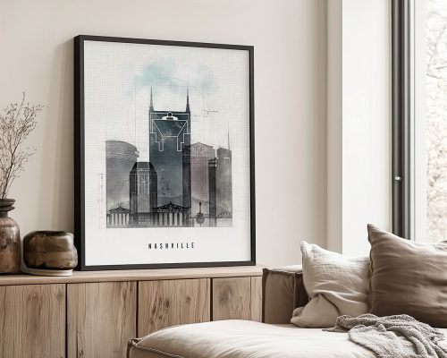 Framed artwork depicting a cityscape of Nashville with prominent buildings and a light blue background.