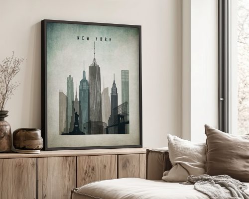 Framed artwork depicting the New York City skyline with notable buildings and the Statue of Liberty.