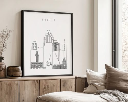 Line art illustration of the Austin city skyline framed and displayed on a wall.