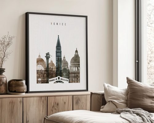 Framed artwork depicting various landmarks of Venice, including a tower and domed buildings.