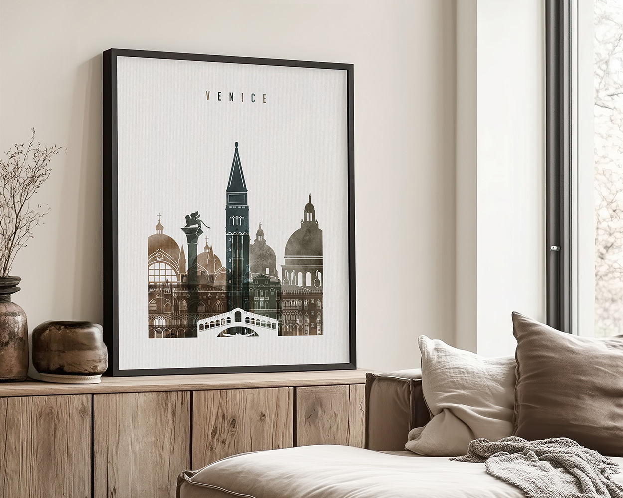 Framed artwork depicting various landmarks of Venice, including a tower and domed buildings.