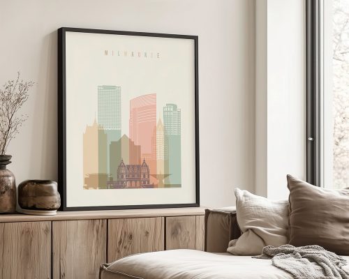 Framed artwork depicting a stylized cityscape of Milwaukee with various building silhouettes.