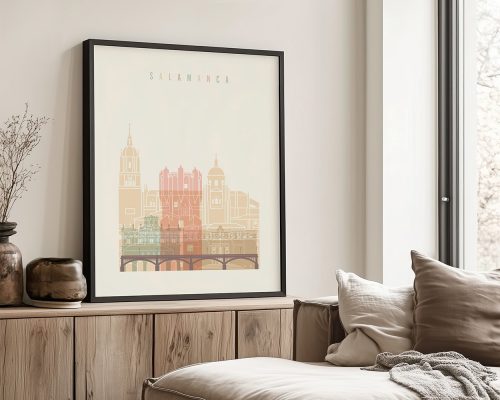 Framed artwork depicting a cityscape of Salamanca with architectural features in warm colors.