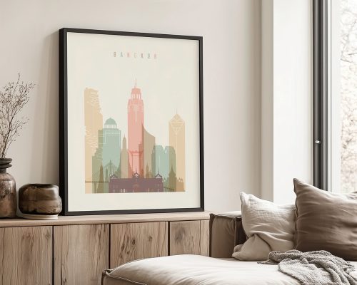 Framed artwork depicting a stylized cityscape of Bangkok with various buildings in pastel colors.