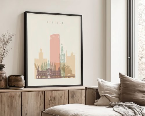 Framed print of a cityscape featuring landmarks from Seville, Spain, displayed on a wall.