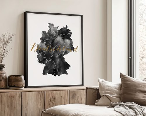 Art print of a black and gold map of Germany with decorative lettering.