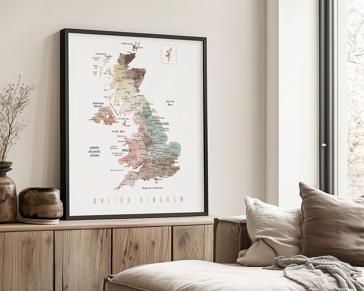 Framed map of the United Kingdom displaying regions and major cities in a neutral color palette.