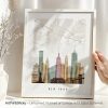 Art print of a New York City map with prominent buildings in a framed design.