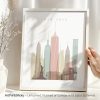 Art print of the New York City skyline featuring iconic buildings in pastel colors.