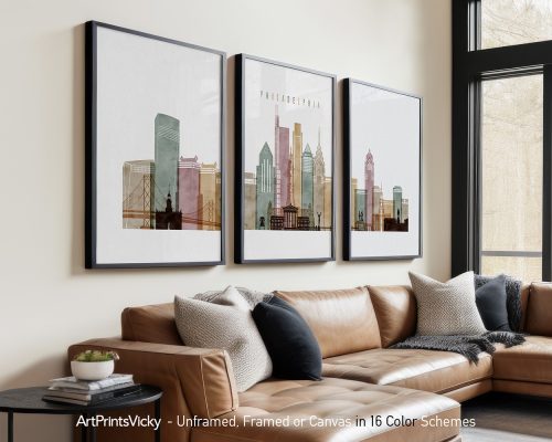 Three framed art prints depicting a stylized cityscape of Philadelphia with various buildings.