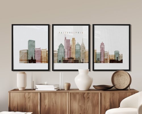 Three framed art prints depicting a stylized cityscape of Philadelphia with various buildings and structures.