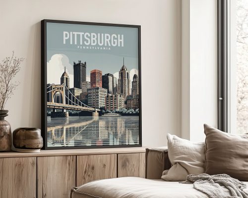 Framed print of Pittsburgh skyline featuring buildings and a bridge over water.